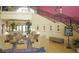 Elegant community clubhouse with comfortable seating and grand staircase at 20620 N Confetti Ct, Maricopa, AZ 85138