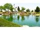 Serene community lake with walking paths and mountain views at 20620 N Confetti Ct, Maricopa, AZ 85138