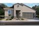 Charming one-story home with a two-car garage and desert landscaping at 20620 N Confetti Ct, Maricopa, AZ 85138