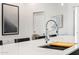 Modern kitchen with a sleek, stainless steel faucet and white countertops at 4220 N 32Nd St # 4, Phoenix, AZ 85018