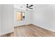 Simple bedroom with wood-look floors and a window at 4220 N 32Nd St # 4, Phoenix, AZ 85018
