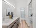 Clean bathroom with double vanity, glass shower, and light wood floors at 4220 N 32Nd St # 4, Phoenix, AZ 85018