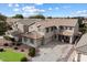 Two-story house with a three-car garage and landscaped yard at 1392 E Baker Dr, San Tan Valley, AZ 85140