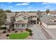 Aerial view of a two-story house with a landscaped yard and driveway, offering a comprehensive view at 1392 E Baker Dr, San Tan Valley, AZ 85140
