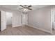 Bright bedroom with wood-look floors and ceiling fan at 17226 N 29Th Dr, Phoenix, AZ 85053