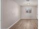 Bedroom with wood-look floors, window, and door at 17226 N 29Th Dr, Phoenix, AZ 85053