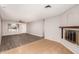 Open living room with fireplace and wood-look floors at 17226 N 29Th Dr, Phoenix, AZ 85053