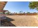 Large backyard with covered patio and partial view of neighboring homes at 17226 N 29Th Dr, Phoenix, AZ 85053