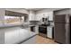Modern kitchen with stainless steel appliances and white cabinets at 17226 N 29Th Dr, Phoenix, AZ 85053