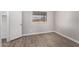 Simple bedroom with wood-look floors and a window at 17226 N 29Th Dr, Phoenix, AZ 85053