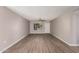 Bright and airy living room with laminate flooring and ceiling fan at 17226 N 29Th Dr, Phoenix, AZ 85053