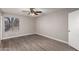 Spacious bedroom with wood-look floors and large window at 17226 N 29Th Dr, Phoenix, AZ 85053