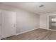 Bedroom with wood-look floors and access to kitchen at 17226 N 29Th Dr, Phoenix, AZ 85053
