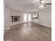 Spacious living room with fireplace, tile flooring, and access to backyard at 17226 N 29Th Dr, Phoenix, AZ 85053