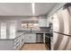 Modern kitchen with stainless steel appliances and white cabinets at 17226 N 29Th Dr, Phoenix, AZ 85053