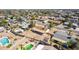 Aerial view showcasing a house, pool, and expansive backyard in a quiet neighborhood at 17226 N 29Th Dr, Phoenix, AZ 85053