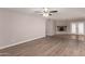 Living room with wood-look floors, fireplace, and access to backyard at 17226 N 29Th Dr, Phoenix, AZ 85053