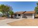Ranch-style home with attached garage and mature landscaping at 17226 N 29Th Dr, Phoenix, AZ 85053