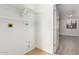 Bright laundry room with built-in shelving and access to other rooms at 17226 N 29Th Dr, Phoenix, AZ 85053