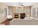 Living room with fireplace, hardwood floors, and comfortable seating at 15120 E Vermillion Dr, Fountain Hills, AZ 85268