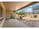 Landscaped backyard with covered patio and stone pathway at 15120 E Vermillion Dr, Fountain Hills, AZ 85268