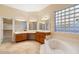 Large bathroom with double vanity and soaking tub at 15120 E Vermillion Dr, Fountain Hills, AZ 85268