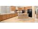 Modern kitchen with wood cabinets, tile floors, and island at 15120 E Vermillion Dr, Fountain Hills, AZ 85268