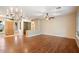 Bright living room with hardwood floors, chandelier, and ceiling fan at 15120 E Vermillion Dr, Fountain Hills, AZ 85268