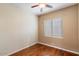 Simple bedroom with hardwood floors and ceiling fan at 15120 E Vermillion Dr, Fountain Hills, AZ 85268