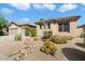 Tan two-car garage home with desert landscaping at 15120 E Vermillion Dr, Fountain Hills, AZ 85268