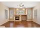 Bright living room featuring a fireplace and hardwood floors at 15120 E Vermillion Dr, Fountain Hills, AZ 85268