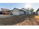 Single story house with white garage door and landscaping at 7394 N 67Th Dr, Glendale, AZ 85303