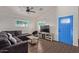 Bright living room with comfy sectional sofa, TV, and wood-look floors at 7394 N 67Th Dr, Glendale, AZ 85303