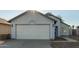 House exterior featuring a white garage door at 7394 N 67Th Dr, Glendale, AZ 85303