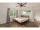 Spacious bedroom with wood-look floors and large windows at 7394 N 67Th Dr, Glendale, AZ 85303