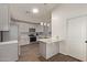 Updated kitchen featuring gray cabinets and a breakfast bar at 7394 N 67Th Dr, Glendale, AZ 85303