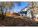 Backyard with patio, grill area, and mature trees at 7394 N 67Th Dr, Glendale, AZ 85303