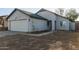 House exterior with white garage door and landscaping at 7394 N 67Th Dr, Glendale, AZ 85303