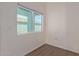 Small spare room with wood flooring and window at 7394 N 67Th Dr, Glendale, AZ 85303