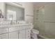 Updated bathroom with gray vanity, marble countertop, and glass shower at 7394 N 67Th Dr, Glendale, AZ 85303