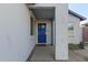 Front entry with blue security door and sidelights at 7394 N 67Th Dr, Glendale, AZ 85303