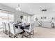 Elegant dining room with seating for six and access to patio at 22788 E Orion Way, Queen Creek, AZ 85142