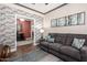 Relaxing Gathering room with exposed brick wall and comfortable sofa at 17626 W Wildwood Dr, Goodyear, AZ 85338