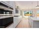 Modern kitchen with stainless steel appliances and white cabinetry at 16970 W Baker St, Surprise, AZ 85387