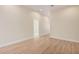 Bright hallway with wood-look floors and access to other rooms at 16970 W Baker St, Surprise, AZ 85387
