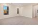 Spacious bedroom with neutral carpeting and ample natural light at 16970 W Baker St, Surprise, AZ 85387