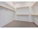 Large walk-in closet with ample shelving and hanging rods at 16970 W Baker St, Surprise, AZ 85387