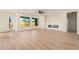 Living room with wood-look tile floors and a modern fireplace at 16970 W Baker St, Surprise, AZ 85387