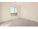 Bright bedroom featuring a large window and neutral decor at 16970 W Baker St, Surprise, AZ 85387