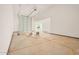Unfinished garage with large overhead door at 16970 W Baker St, Surprise, AZ 85387